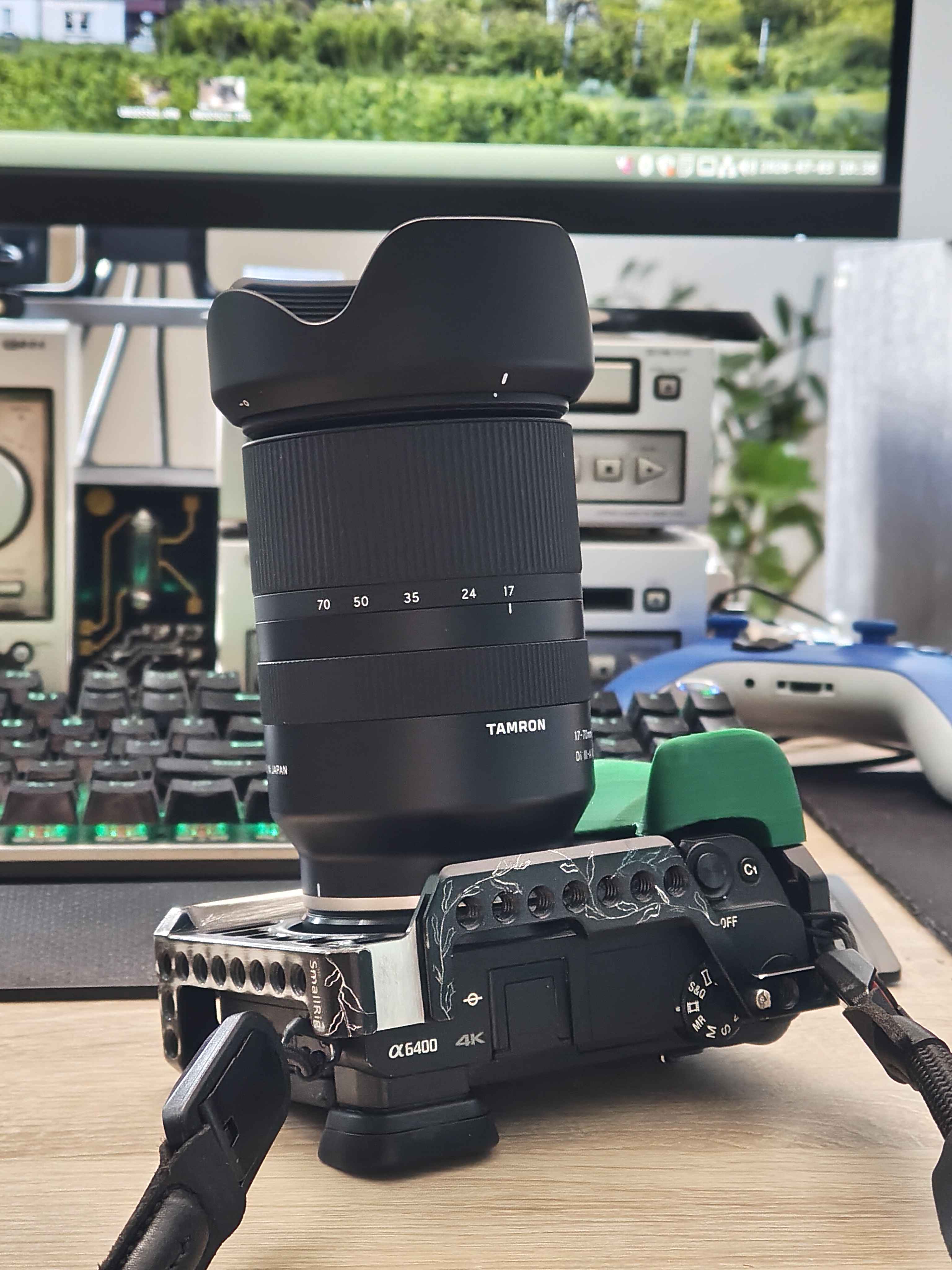 a camera in a dedicated cage with quite a big lens attached.